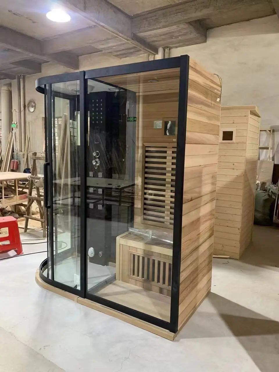 Intérieur de la cabine LN000A avec banc bois, douche pluie et hammam vapeur